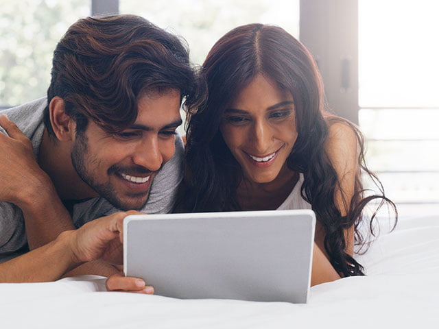 Couple looking at tablet